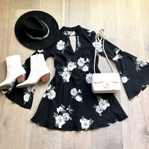 Black floral dress with keyhole neck and back and bell sleeves